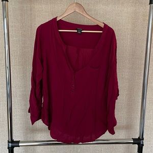 Reddish/maroon blouse